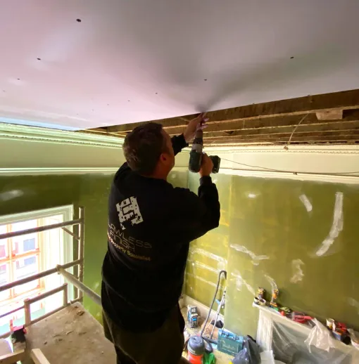 Josh Davis at work on a ceiling